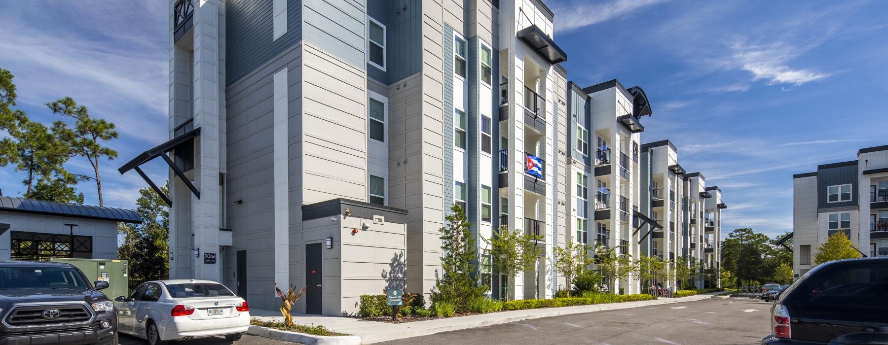 a building with cars parked in front