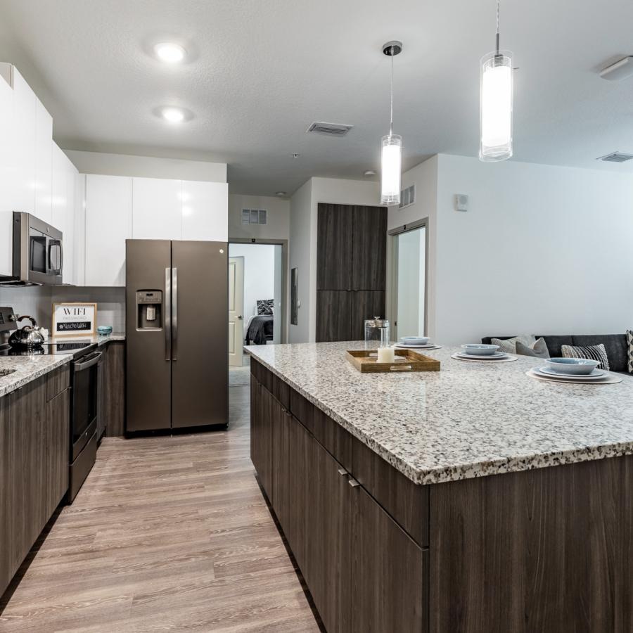 a kitchen with marble counters