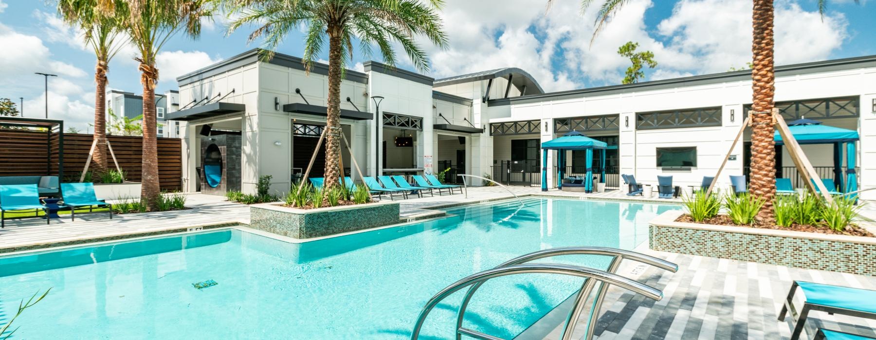 a swimming pool with palm trees