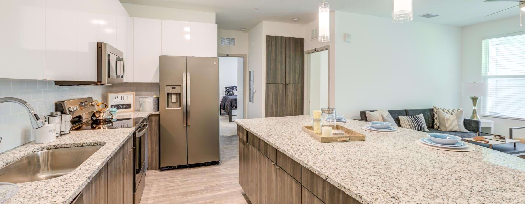 a kitchen with marble counters