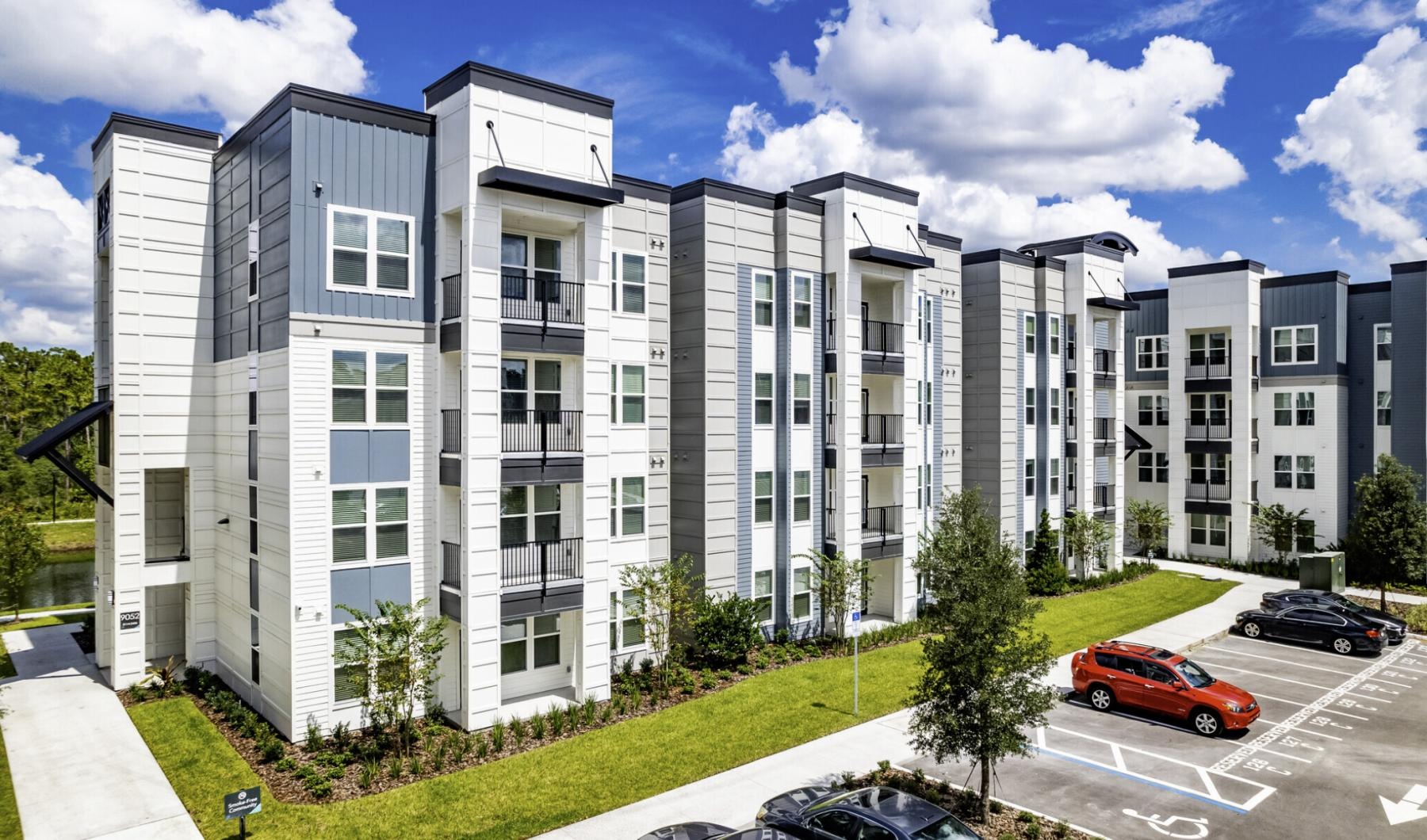 a building with cars parked in front